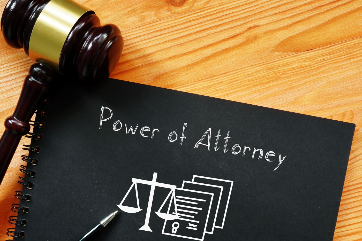 Gavel and Power of Attorney word in notebook