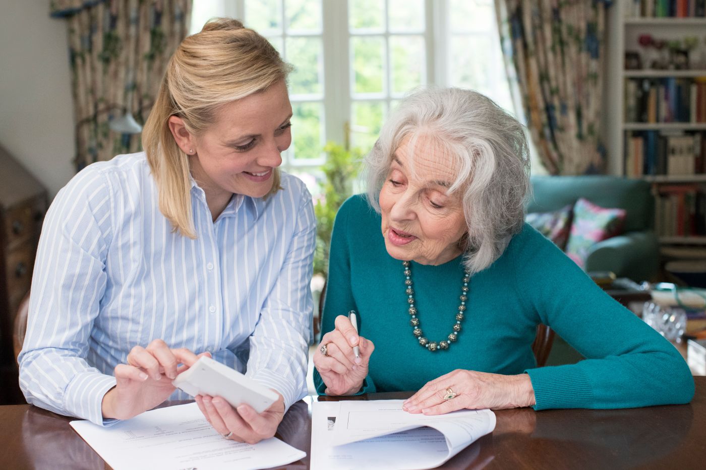Old women discussing estate plan option with professional