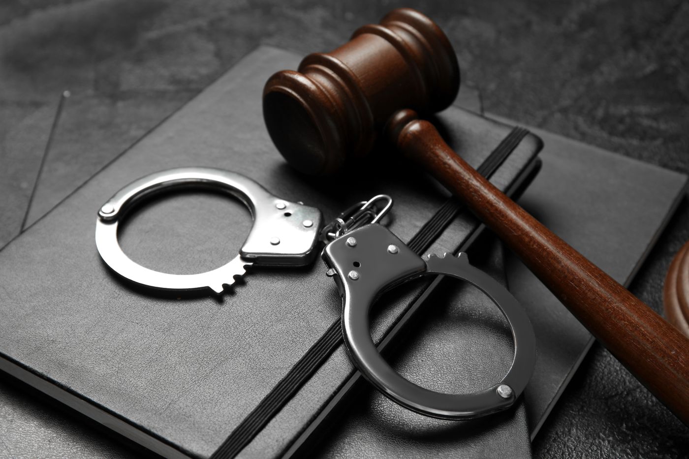 Handcuff and Gavel in table