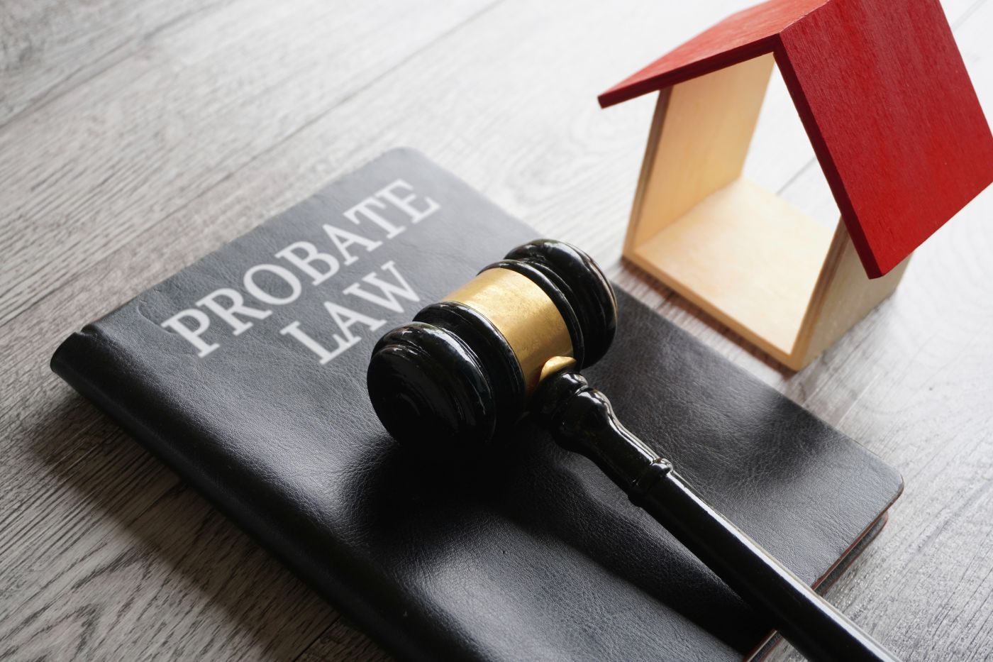 Probate Law book, gavel and house model in table