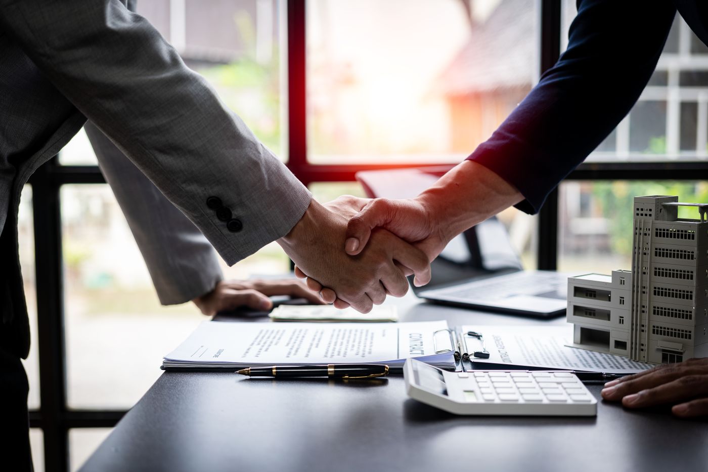 Businessmen shaking hand after lease agreement