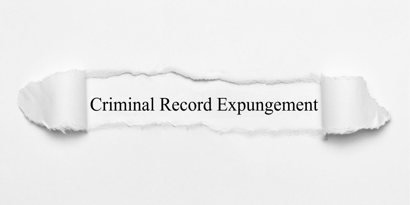 Criminal Record Expungement word on white torn paper