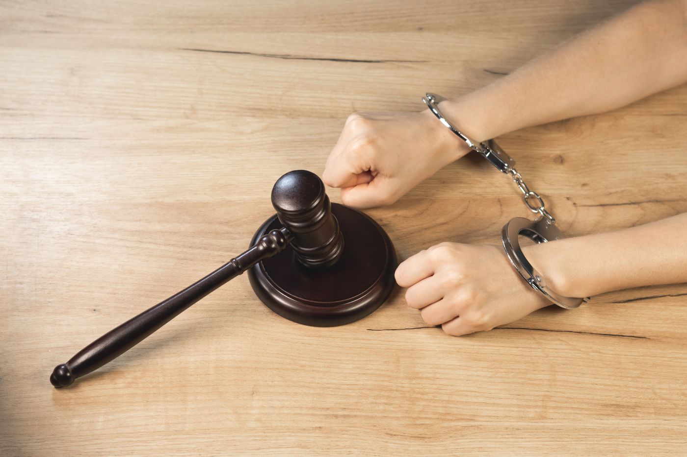 Handcuffed man with gavel