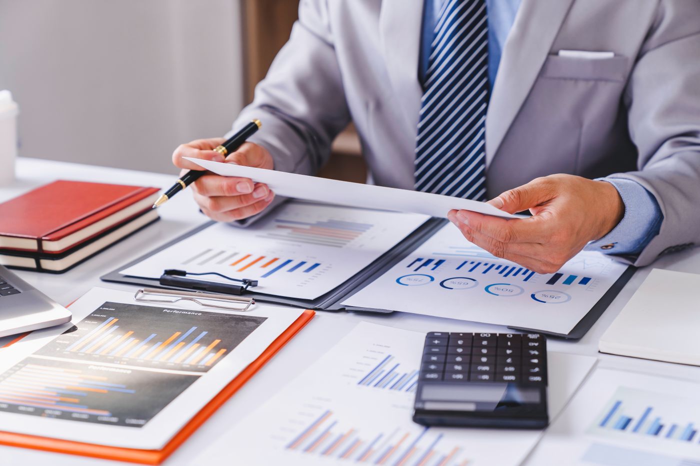 Businessman preparing company performance report