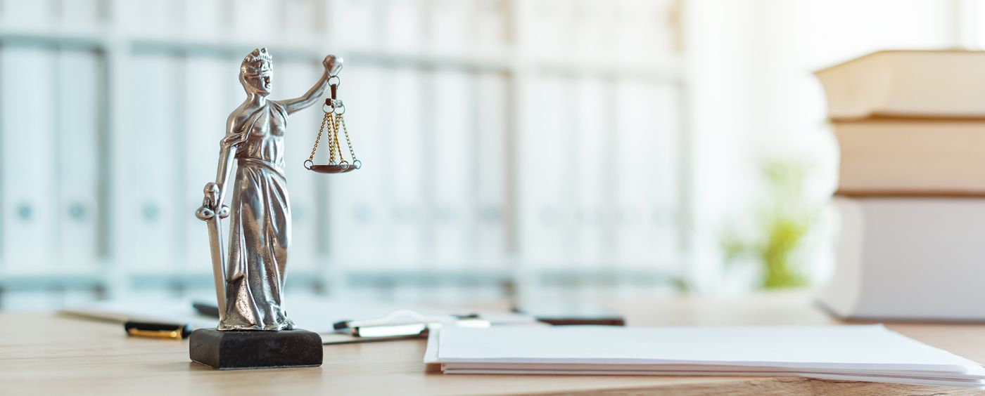 Lady Justice statue in law firm office