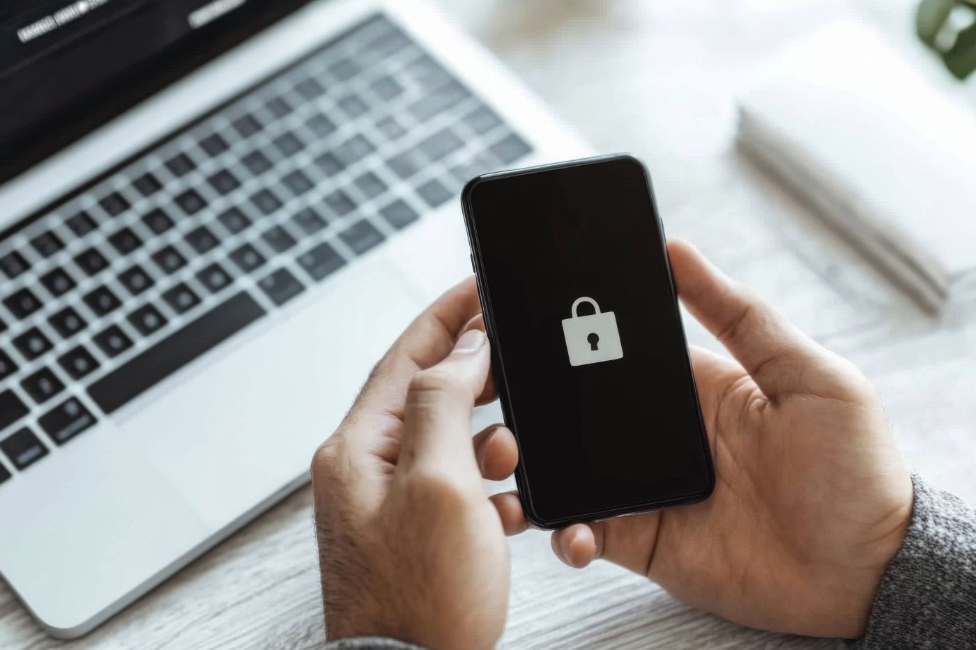 Man with lock symbol in his phone