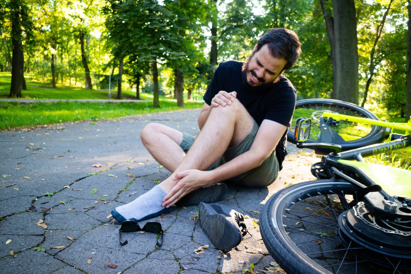 Man on road with ankle injury after E Bike Accident
