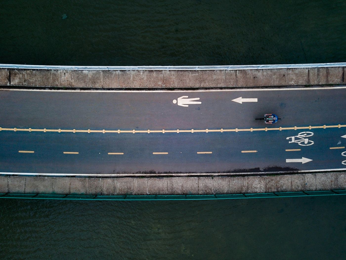 Overhead view of a bike lane that is next to a walking trail