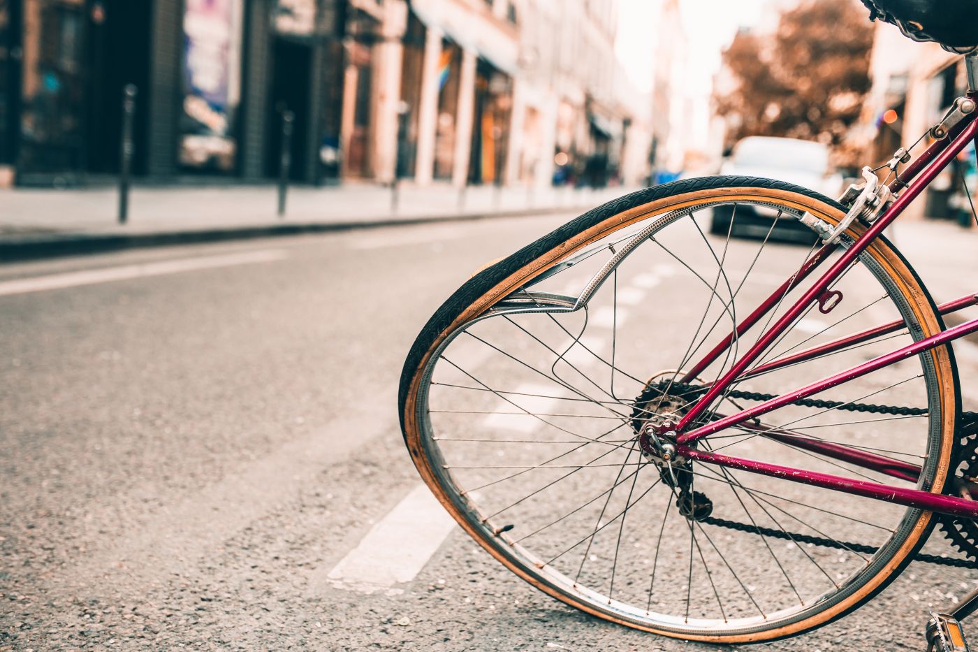 Damaged bicycle with a bent wheel during a road accident