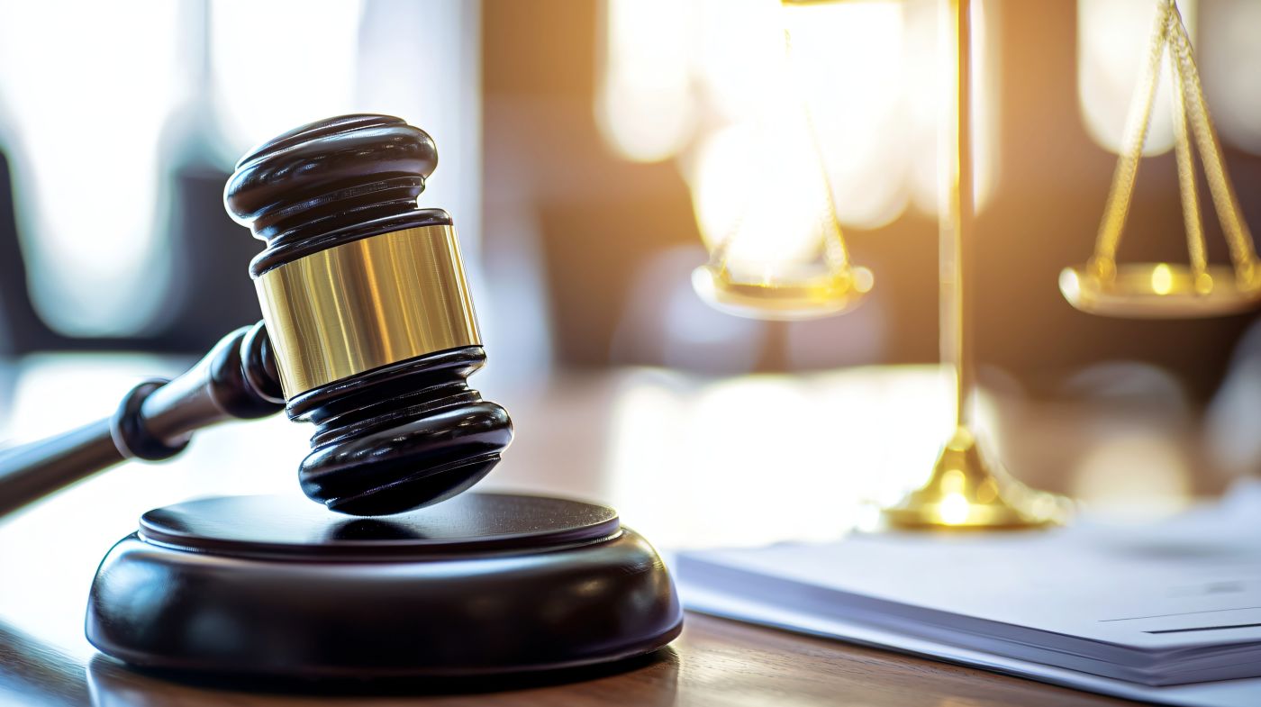 Gavel and Scale of Justice in table