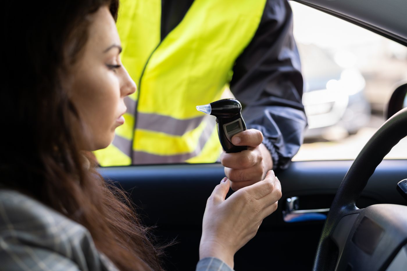 Women giving breathalyzer test