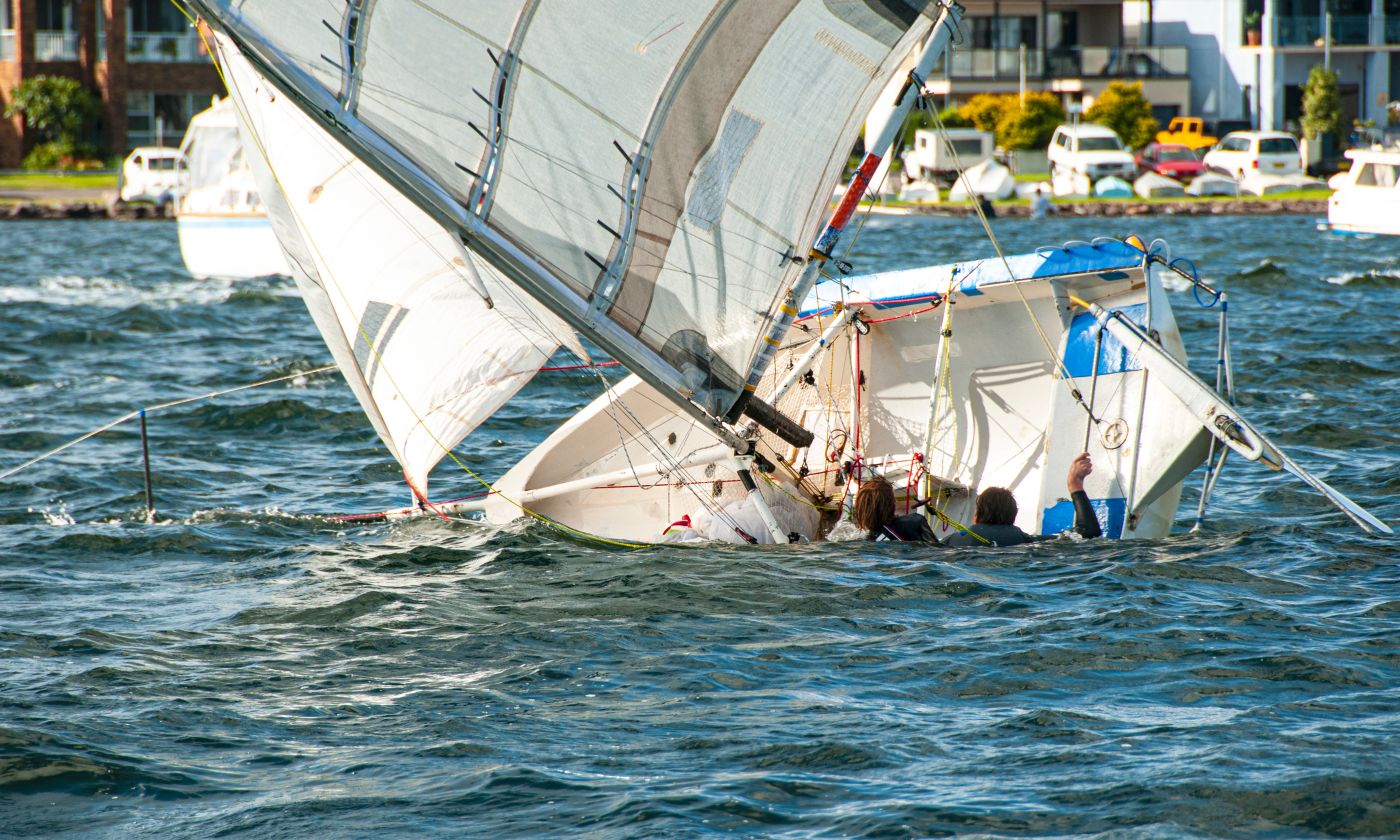 Person climbing back into sailboat