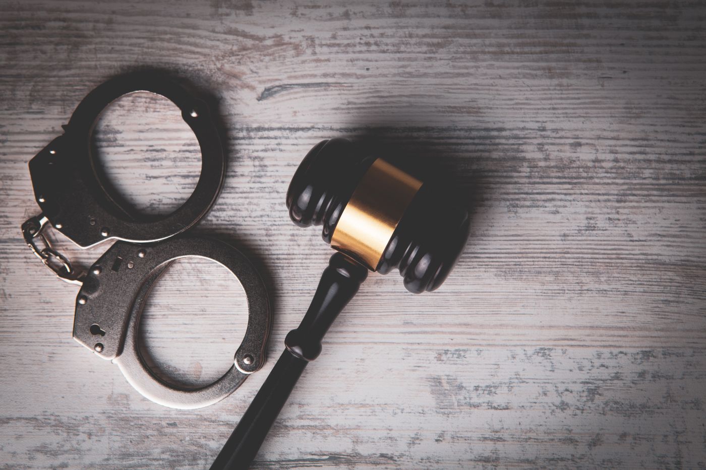 Gavel and Handcuff in table