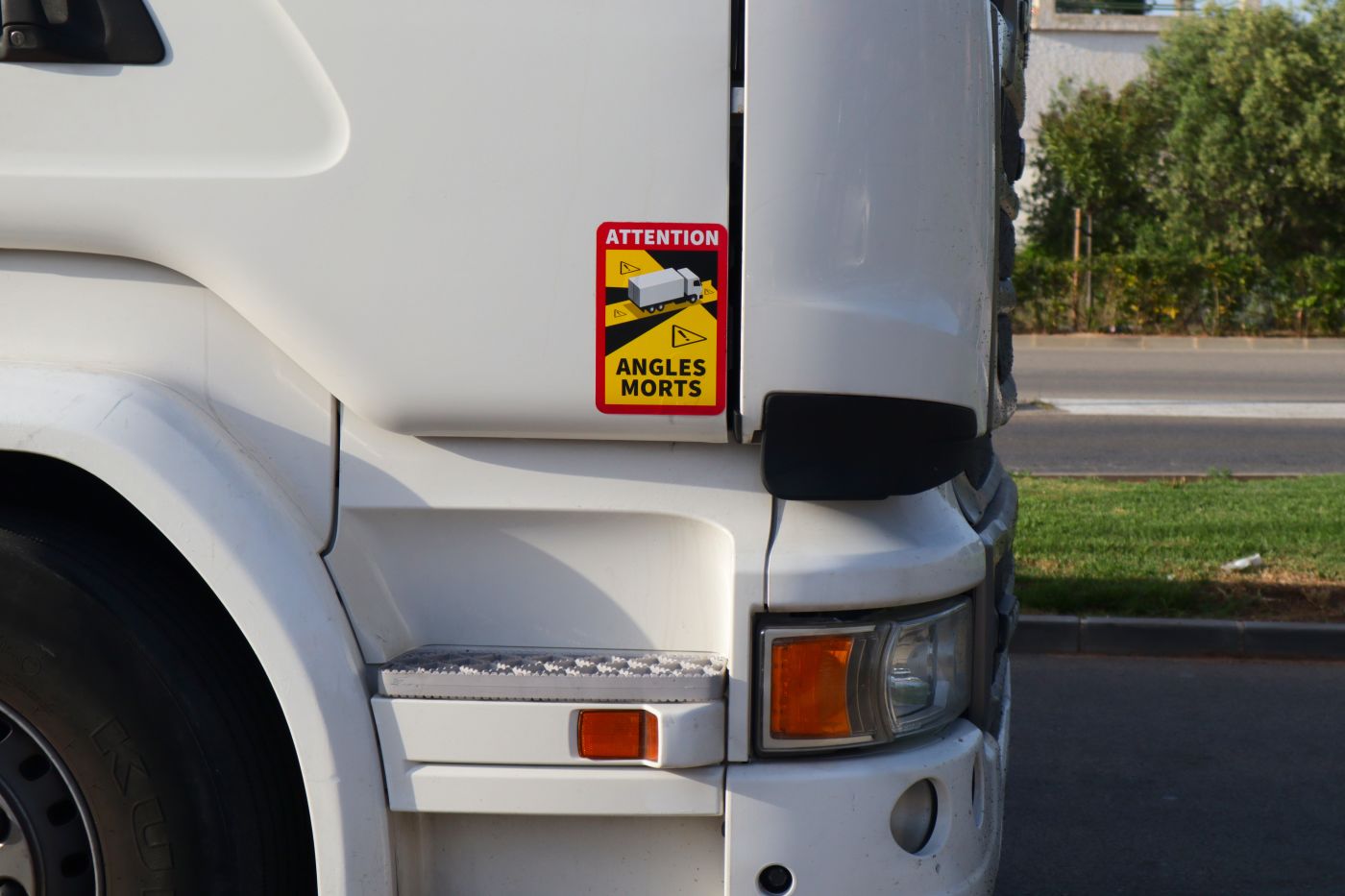 Sticker in truck indicating blind spot in that area