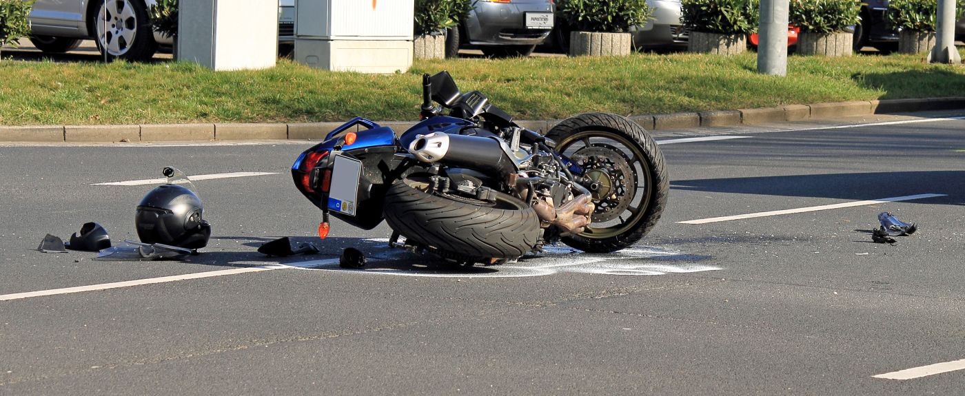 Crashed motorcycle on road