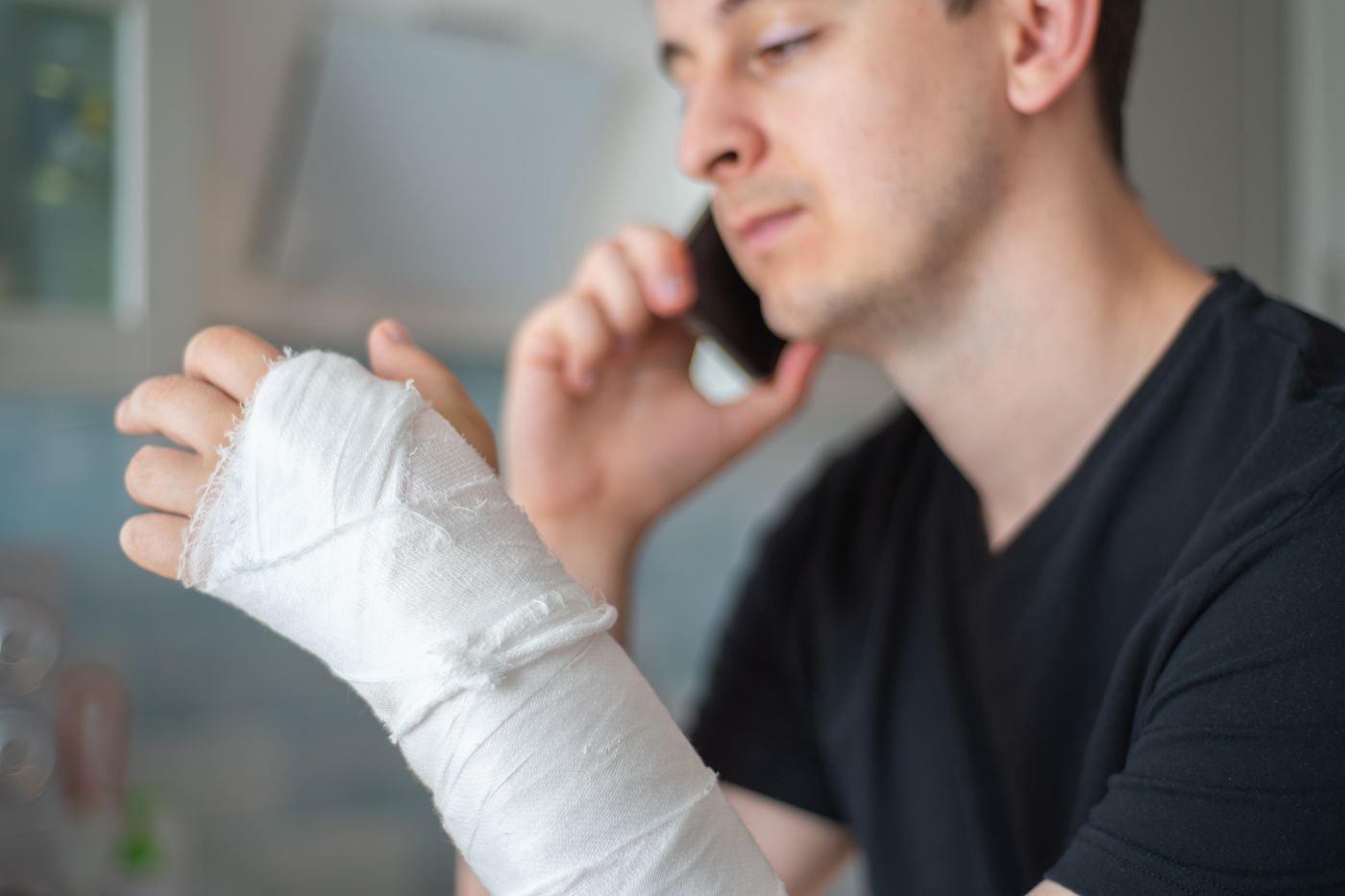 Injured man talking on phone