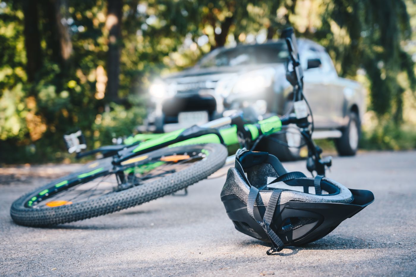 Bicycle and helmet on road after accident