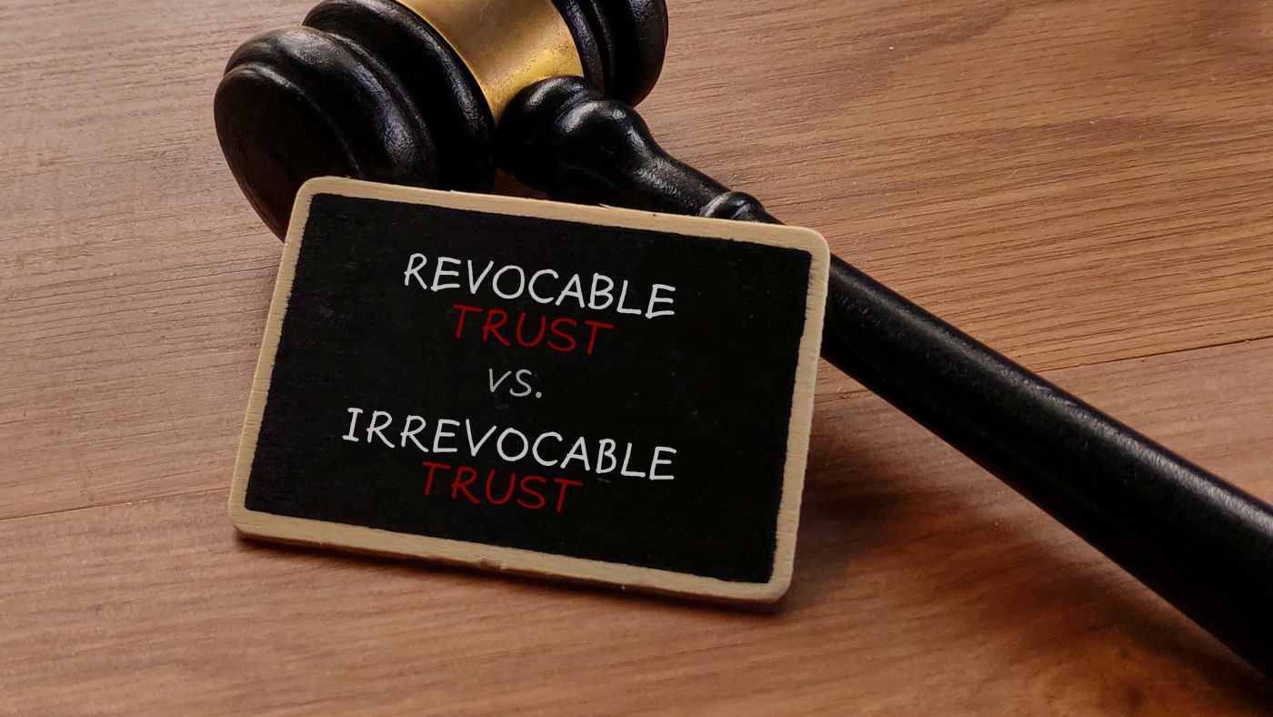 Revocable vs. Irrevocable Trust word on board with Gavel