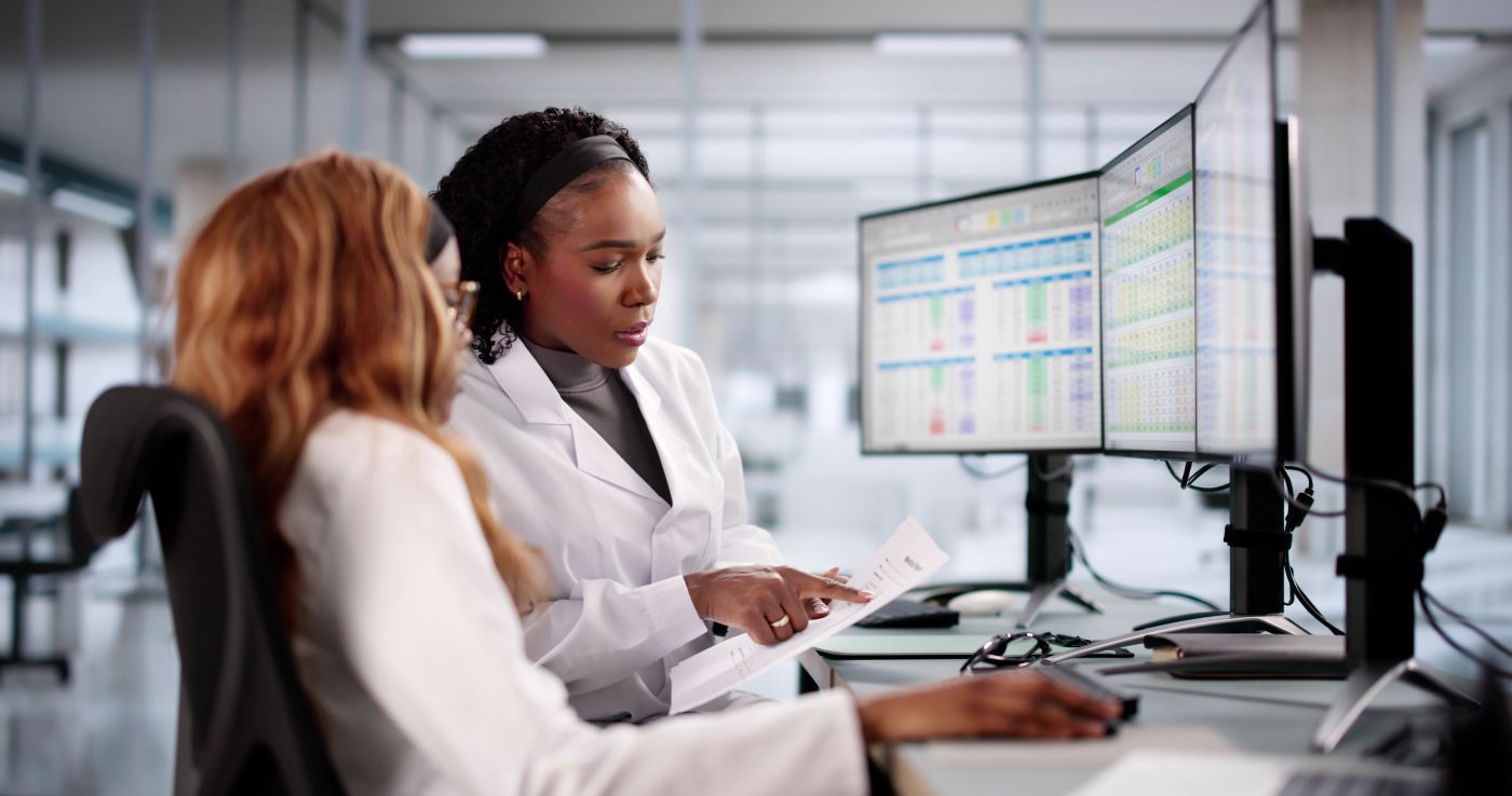 Medical coder enters billing codes into spreadsheet