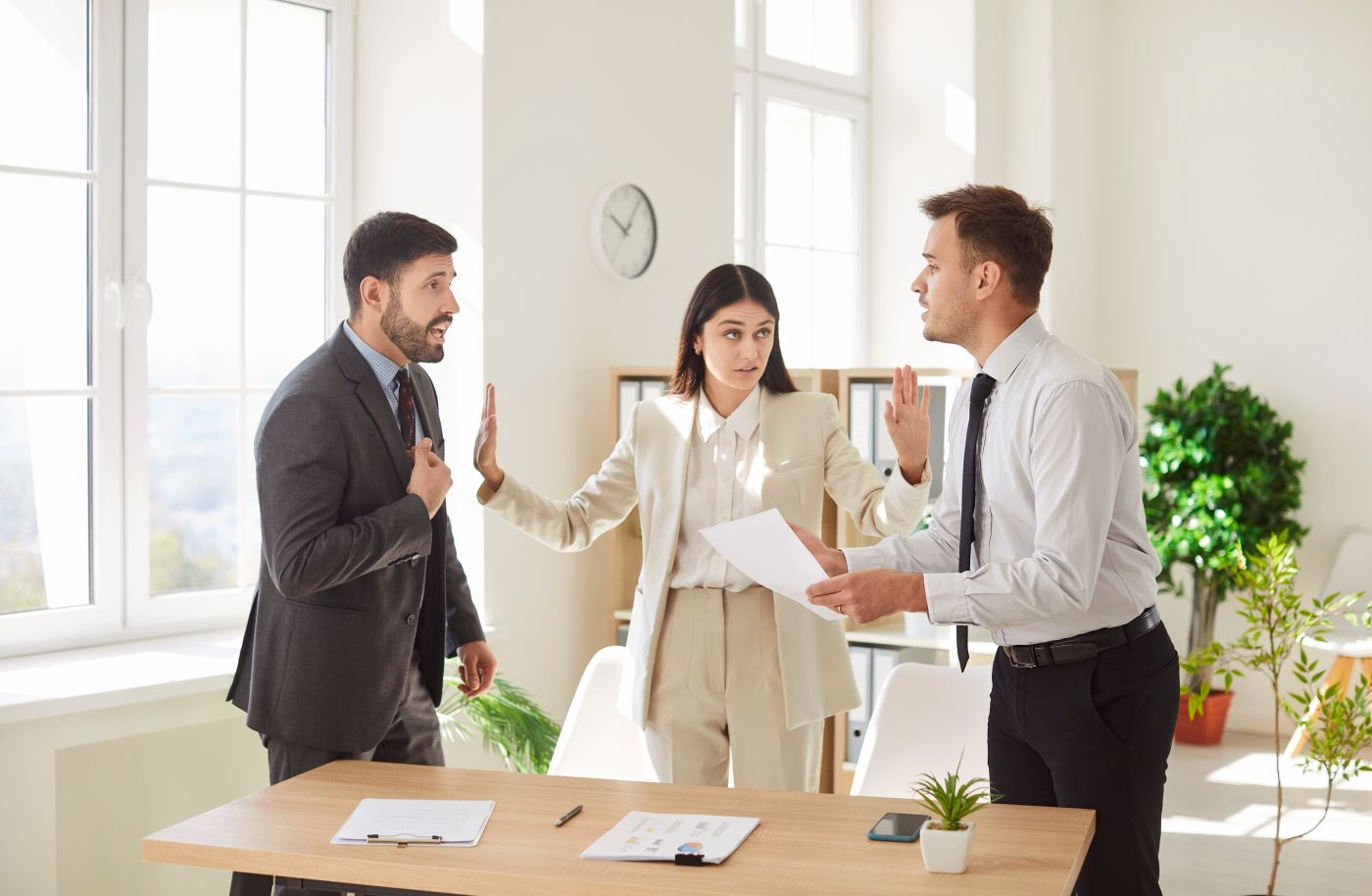 Women trying to resolve dispute of two businessmen