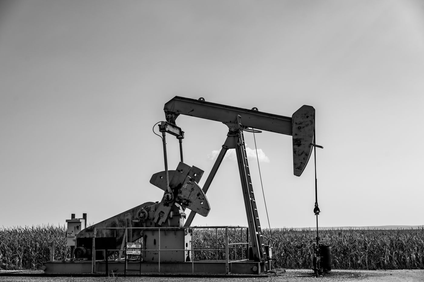 Oil pump jack against an open sky