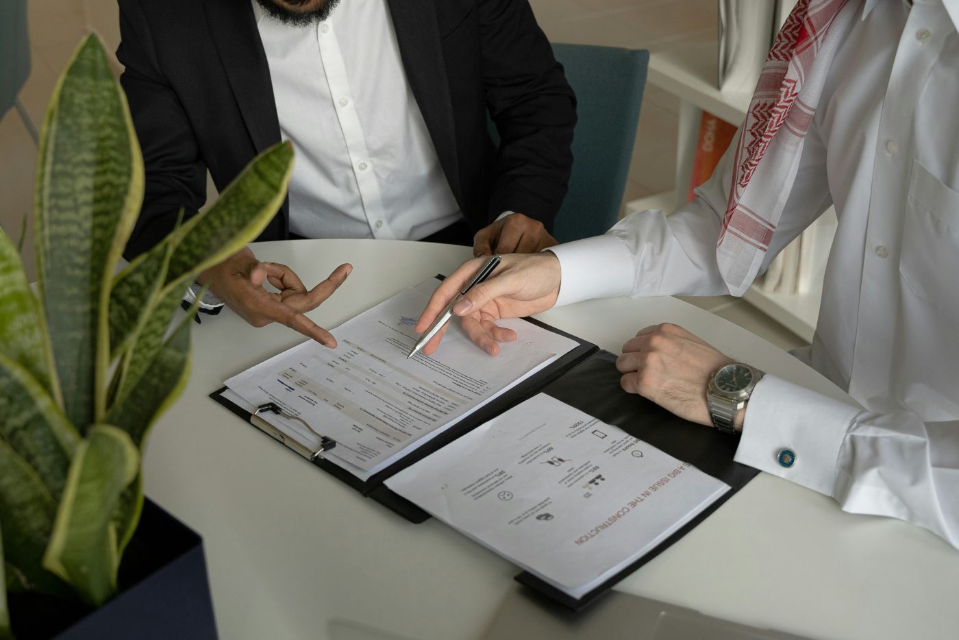 Employer and employee reviewing contract terms