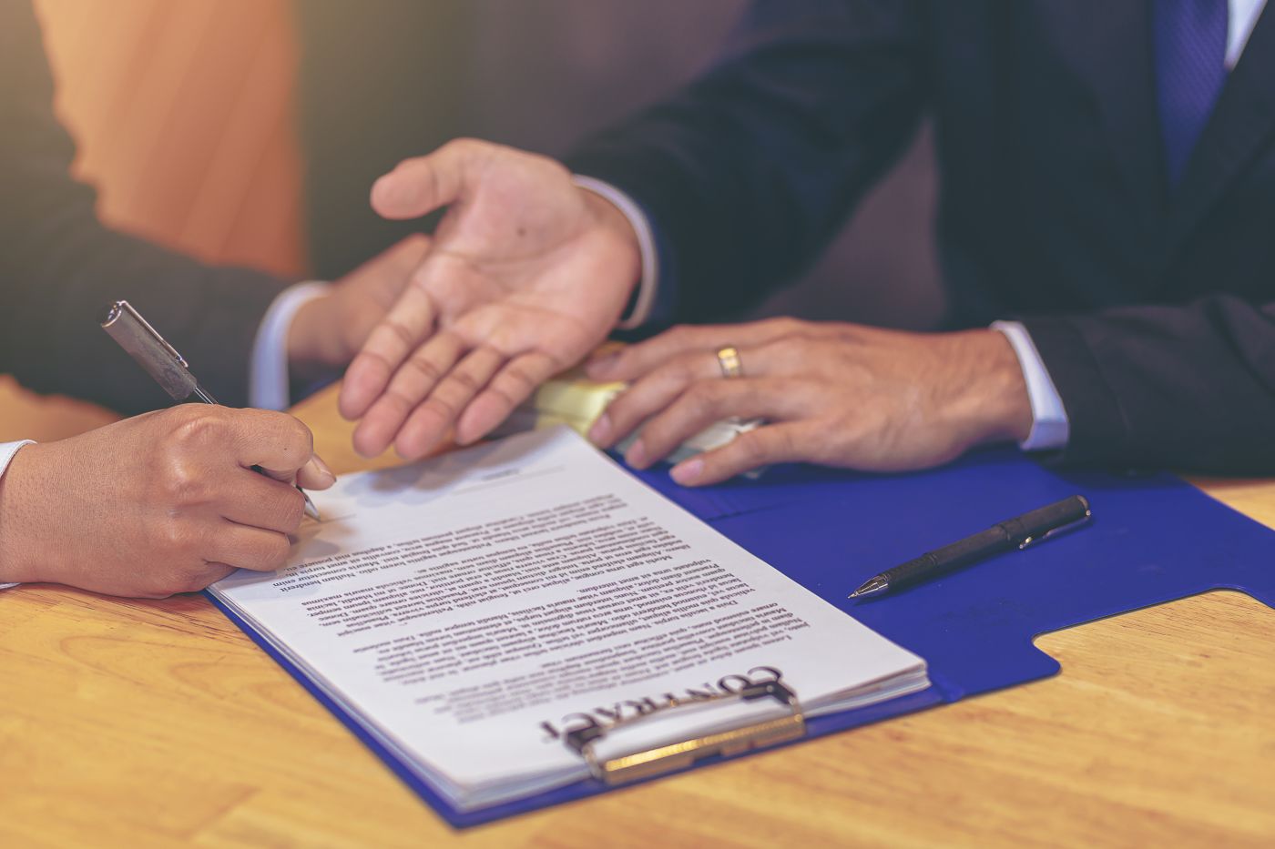 Businessmen signing contract