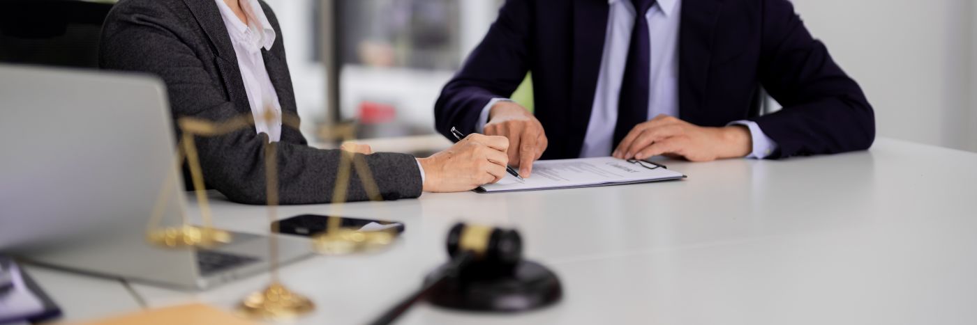 Client reviewing commercial contract with attorney