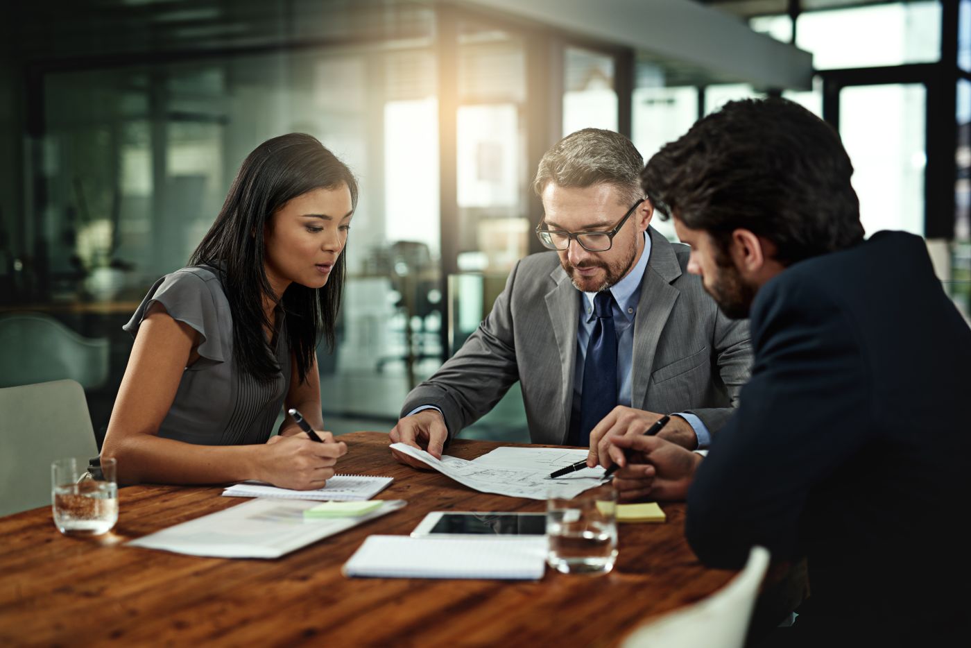 Businesspeople negotiating contract terms