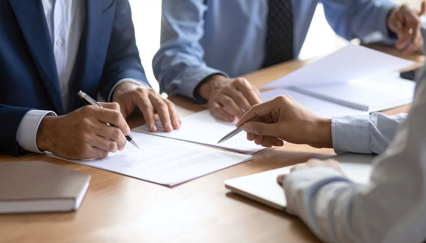 People discussing contract document