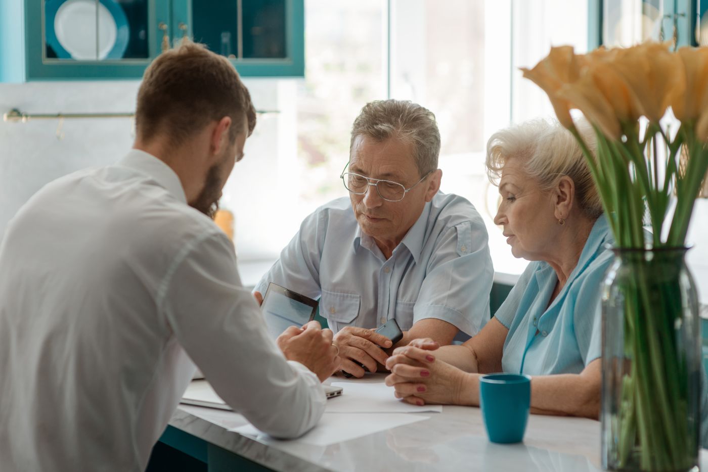 Senior couple consulting with professional for estate planning