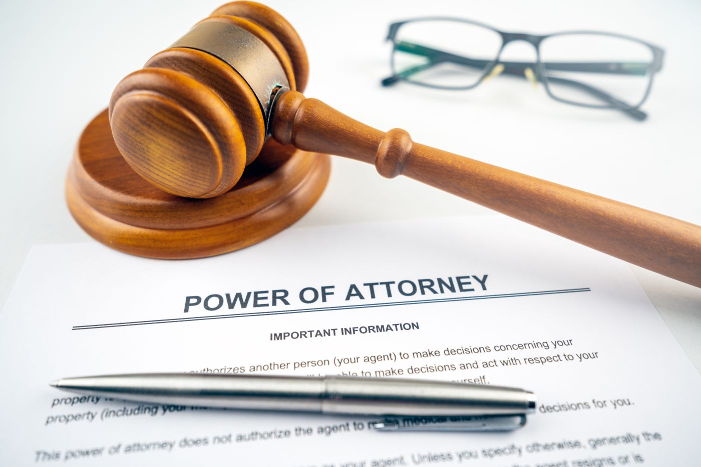 Power of Attorney file and gavel on table