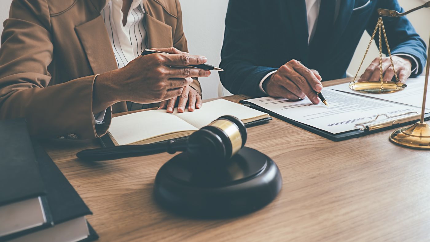 Attorney consulting client in office
