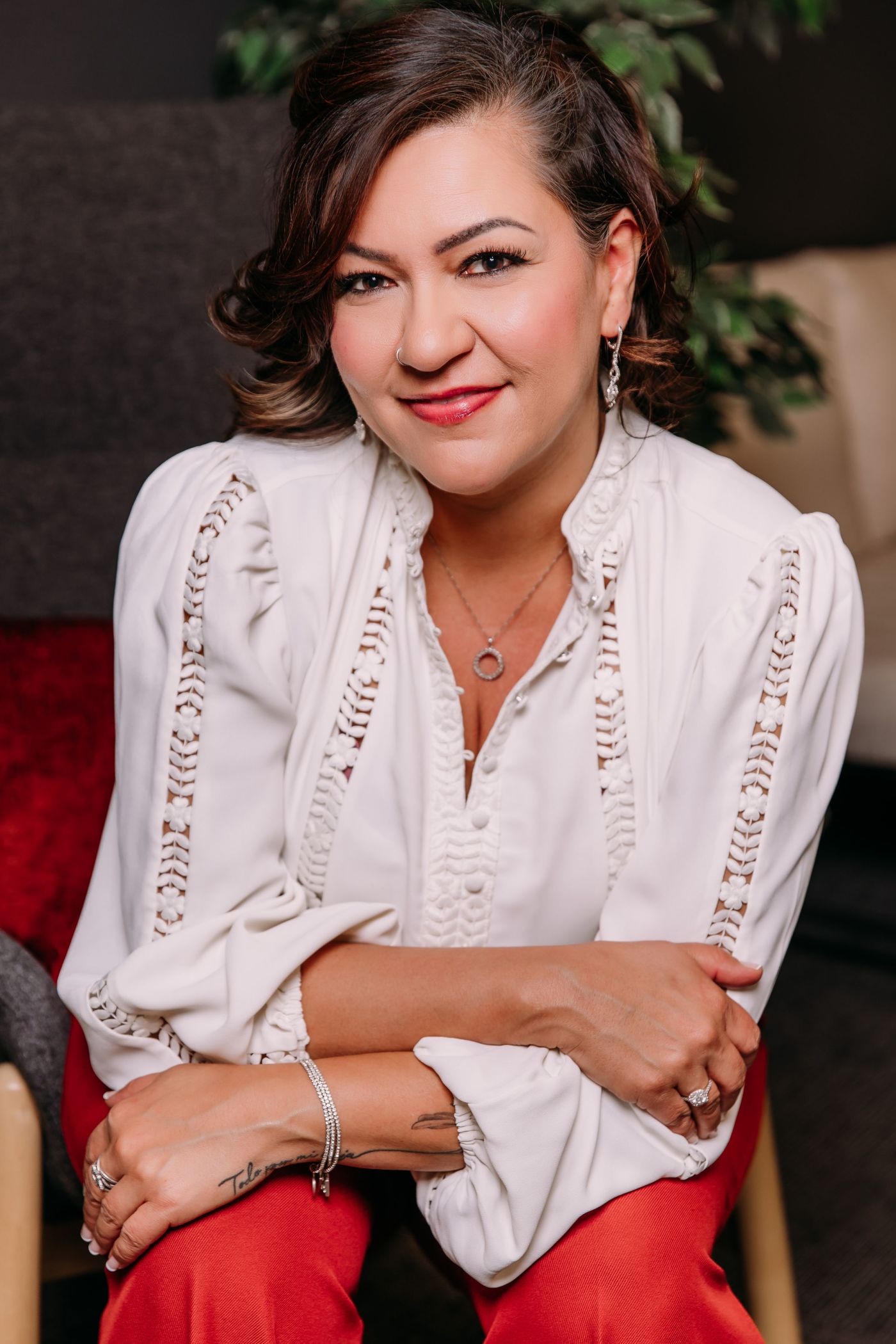 LLP Veronica Gonzales sitting in a chair looking friendly.