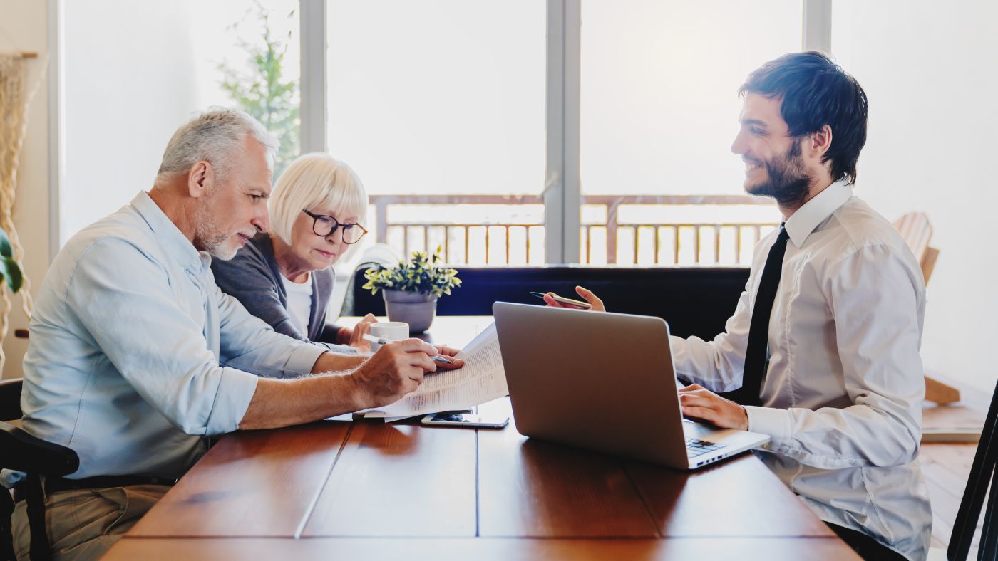 Senior couples consulting with attorney for estate planning