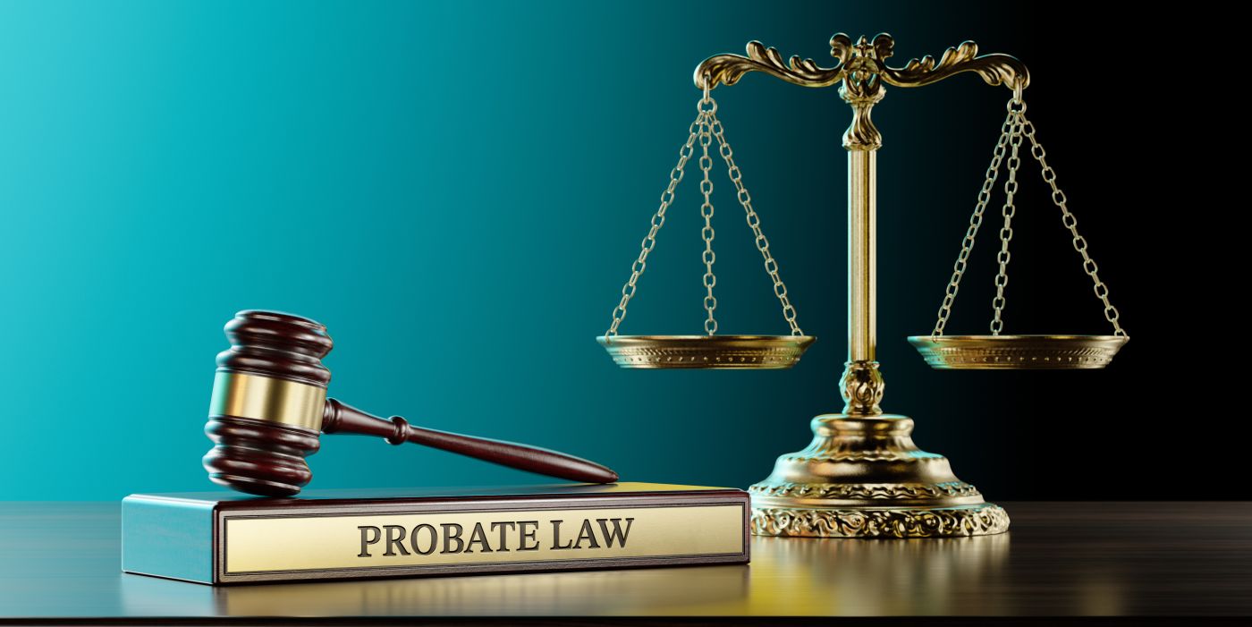 Probate Law book, gavel and scale of justice in table