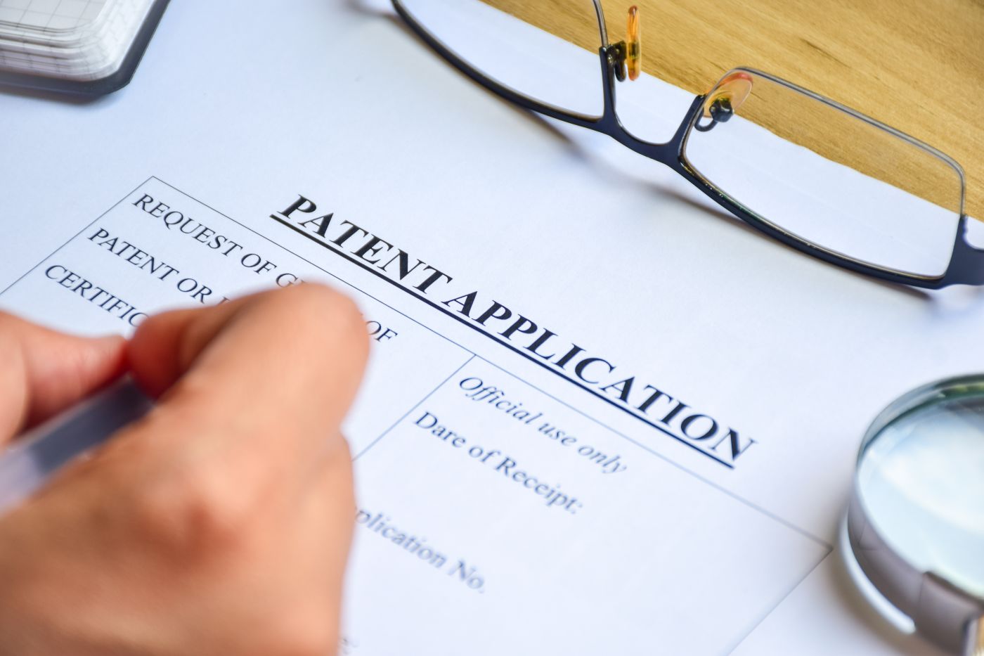Person filling out Patent Application