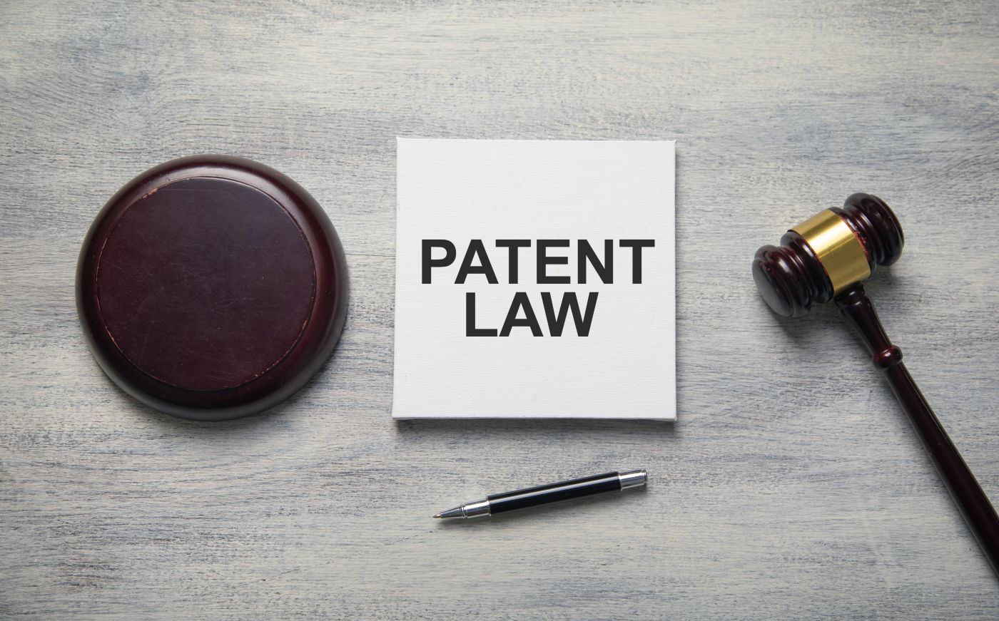 Patent Law text with a judge gavel