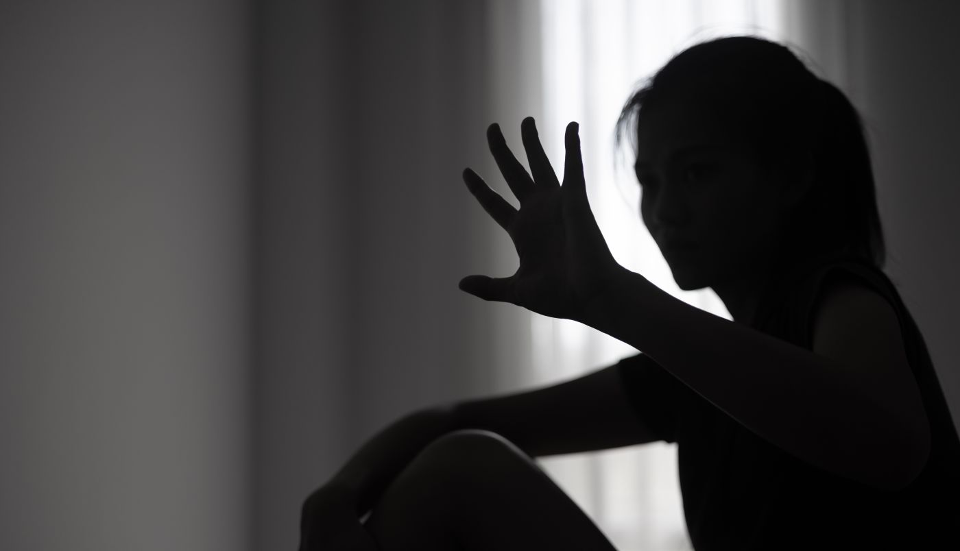 Women showing hands signaling to stop sexual harassment