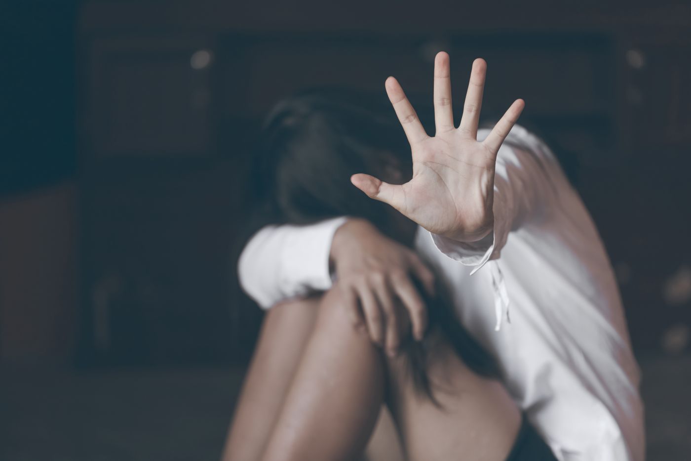 Women show hands gesturing to stop sexual violence