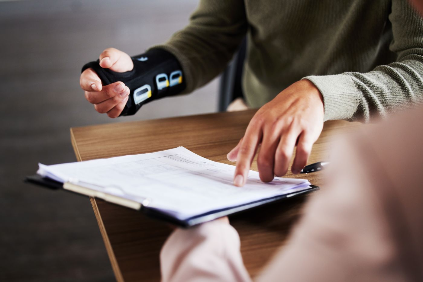 Injured man consulting with attorney