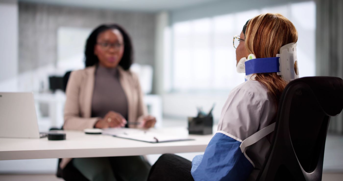 Injured women consulting with attorney