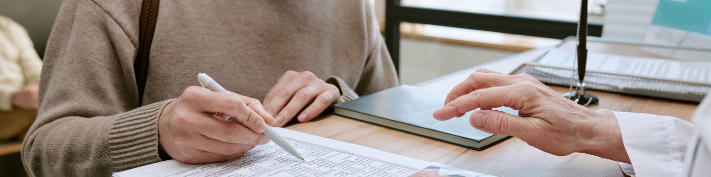Person looking at the medical paperwork