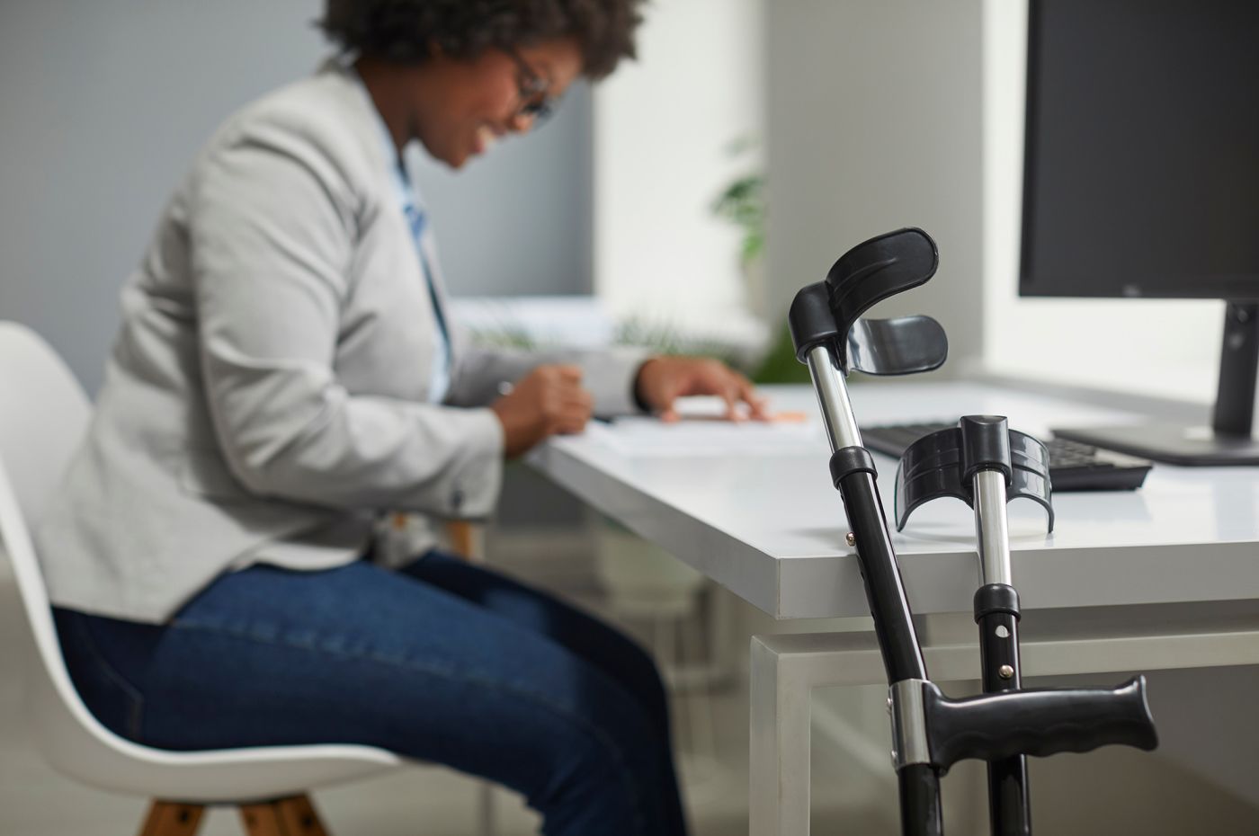 Disabled employee working in office.