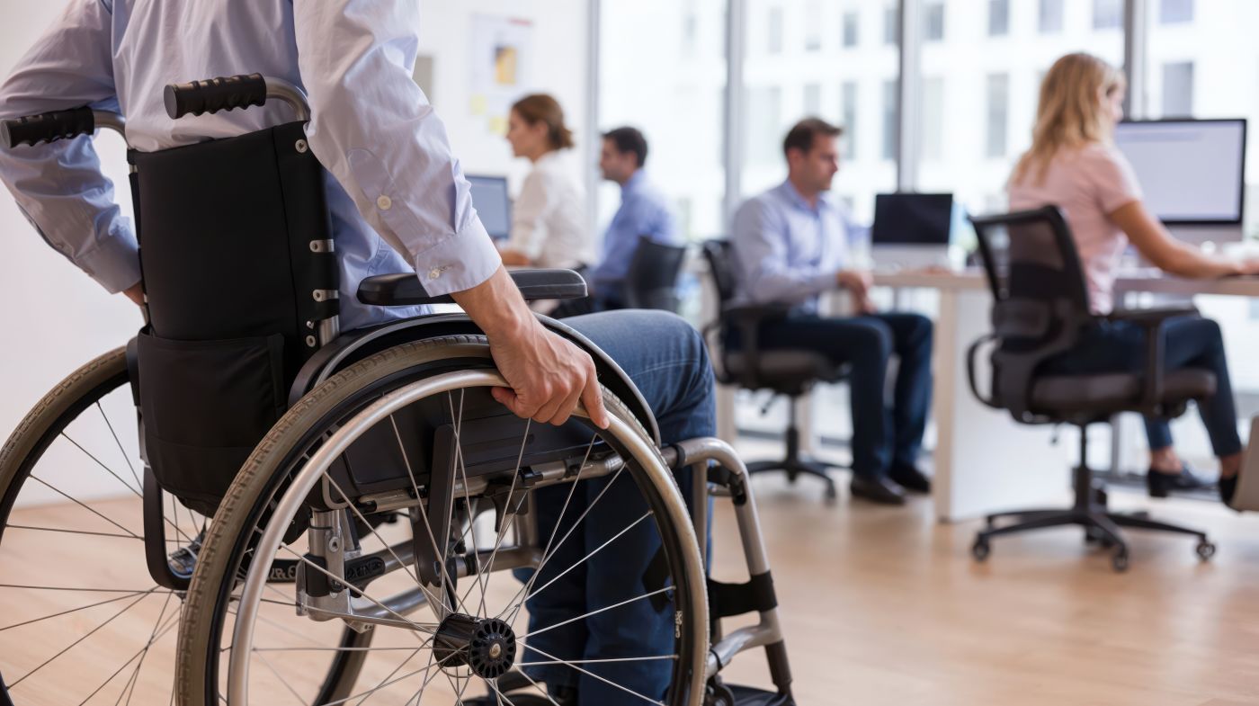 Man in wheelchair in office