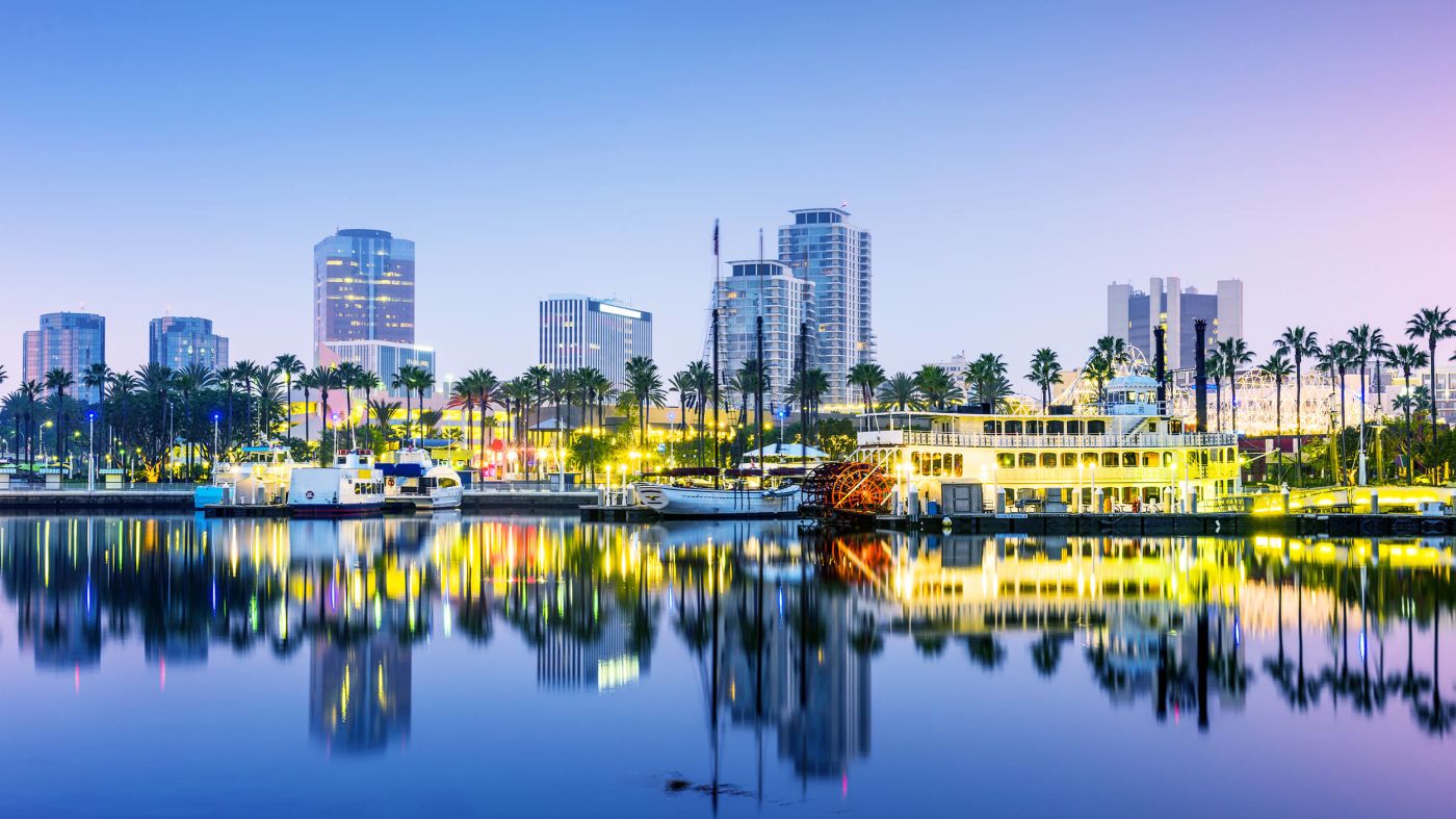 long Beach harbor with boats and lights and cityscape behind