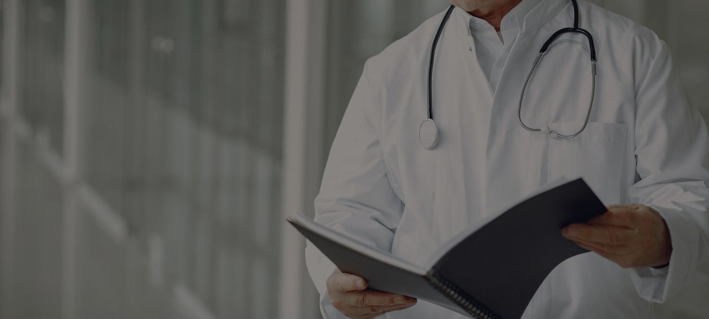 Doctor looking at files