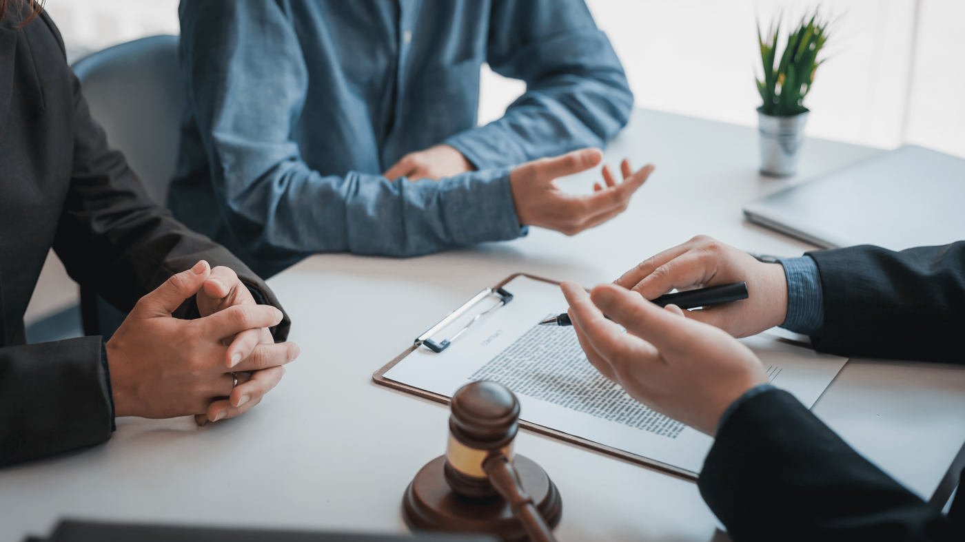 Business people and lawyers talk and contract together. Signing of a contract in the presence of an attorney.