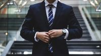 Man buttoning his suit