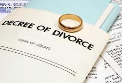 decree of divorce document and wedding ring